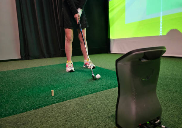 istock Player prepares to swing at an indoor golf simulator during a practice session 2193847702