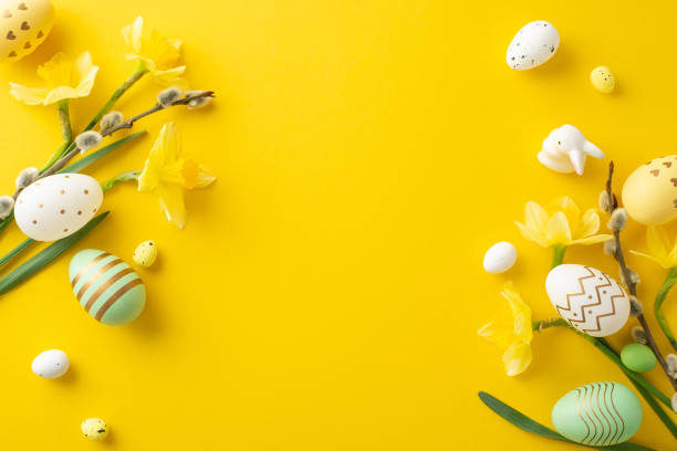 istock Colorful eggs and vibrant flowers on a yellow background, symbolizing Easter celebrations 2193847888