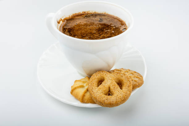 istock Danish cookies on a white background with coffee in a white cup, freshly brewed American coffee, isolate, breakfast, pastries, delicious shortbread cookies, catalog photo of food, coffee in bed 2193851206