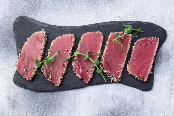 istock Sliced tuna steak with sesame photography . Top view 2193854304