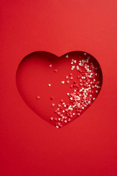 istock Red heart with scattered small hearts representing love and affection 2193856425