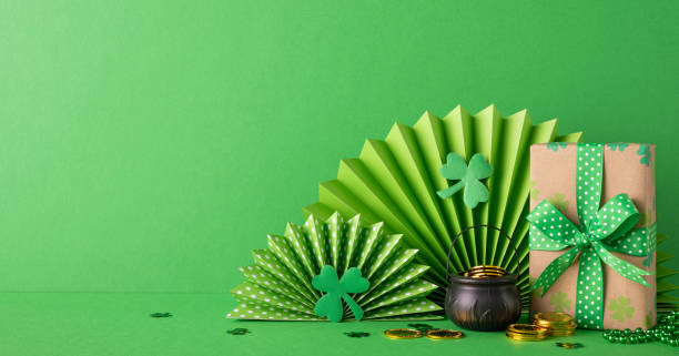 istock Various Saint Patrick's Day decorations including green paper craft, coins, and a wrapped gift. Ideal for festive celebrations with vibrant and joyful tones 2193856457