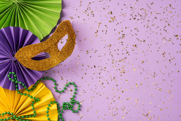 istock Festive Mardi Gras composition featuring glittery masks, colorful beads, decorative papers, and confetti embellishments, radiating celebration and carnival atmosphere 2193856458
