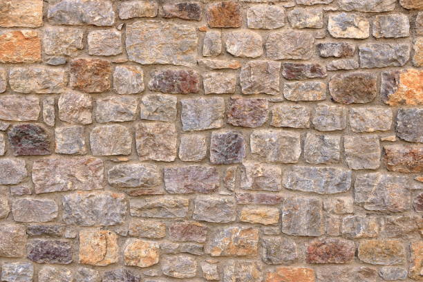 istock yellow beige sand color stone brick vertical wall 2193860999