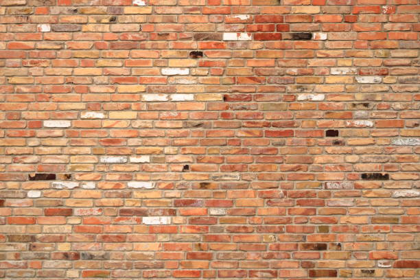 istock Old brick wall, old texture of red orange stone blocks 2193862228
