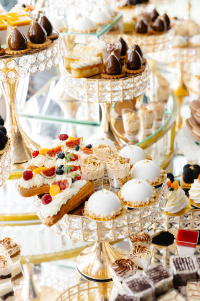 Delicious macarons and pastries decorating a luxurious candy bar buffet