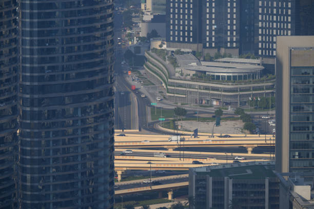 Cityscapes and details of tall skyscrapers in the futuristic city of Dubai at night and during the day