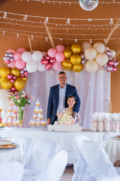 istock Fun and love between father and daughter on First Communion day 2193864833