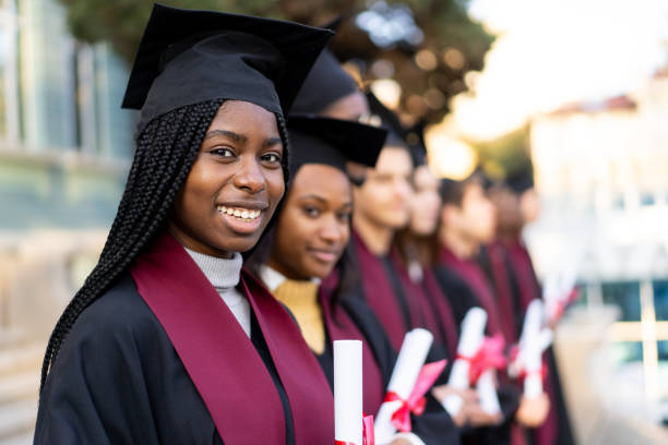 istock Student holds their degree line up for a photo 2193866745