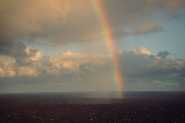 Madeira dreamlike seascape. Picturesque view of the ocean horizon with vibrant rainbow & soft clouds, evoking sense of tranquility & awe at the beauty of nature