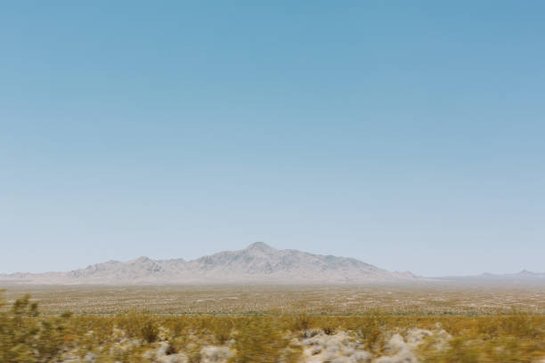 A desert view with a mountain in the background in California.