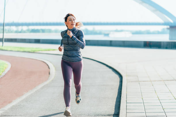istock Happy sportswoman running 2193868453