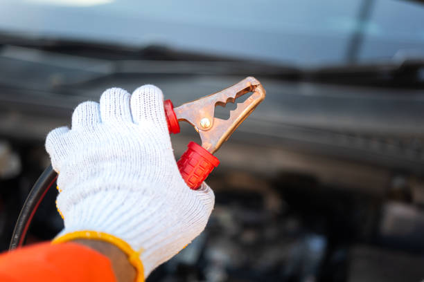 Auto repair technician has inspected the condition of the engine using ammeter, Car repair service concept.
