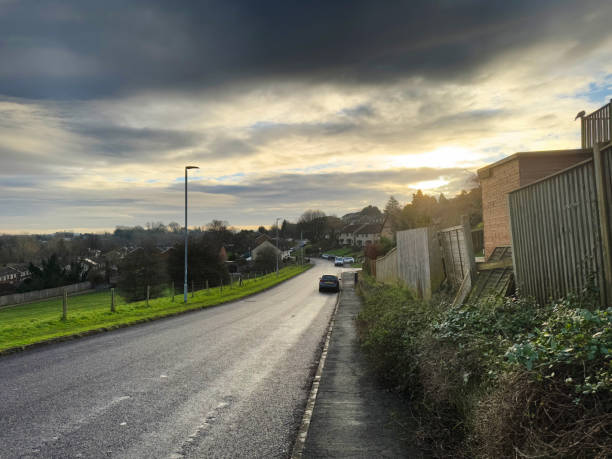 istock Road through a residential district of a small town 2193873576