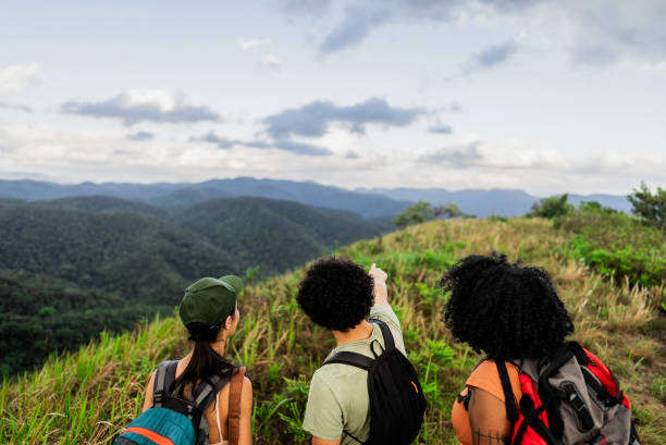 istock Friends looking away during hiking on mountain 2193874267