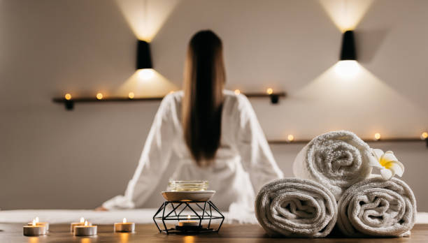 istock A young woman in a spa removes her bathrobe, preparing for a massage. 2193878569