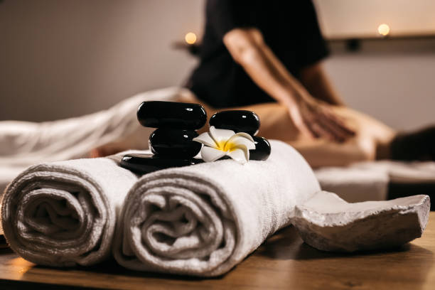 istock Hot stones for massage on towels in a modern spa. 2193878774