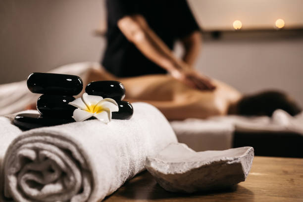 istock Hot stones for massage on towels in a modern spa. 2193878799