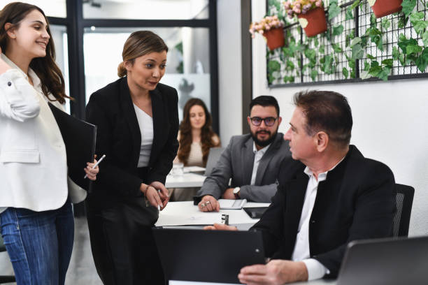 istock Male CEO Analyzing Female Employee's Results While They're Waiting to Hear His Feedback 2193879442