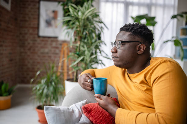 istock Thoughtful gaze and holding blue mug in a cozy room 2193879473