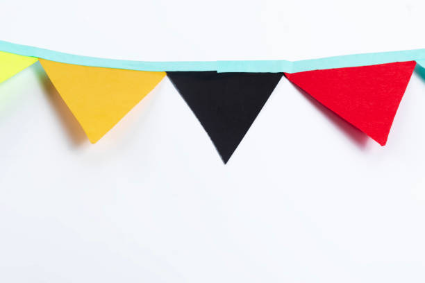 Bright and colorful decorative bunting flags made of paper, set against a white background. Ideal for festive celebrations, party decor, and holiday designs.