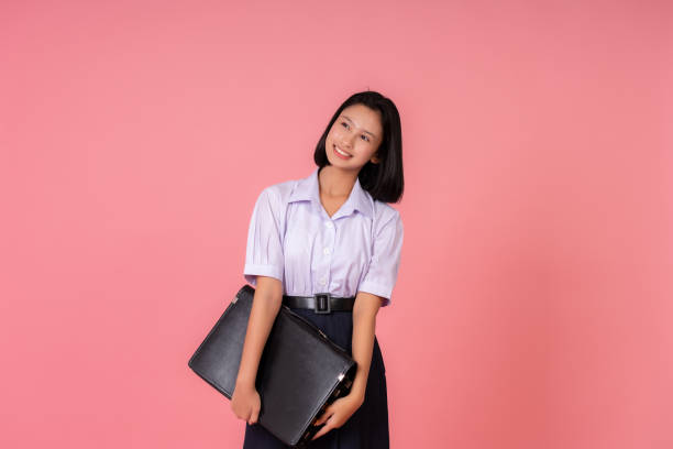 istock The Asian school girl sat by the studio window, writing down her thoughts on how education could transform lives and ignite the light of knowledge in every corner of society. 2193880166