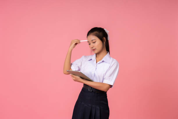 istock While others rested, the Asian school girl stayed in the studio, pursuing education with unwavering dedication and gaining knowledge that would set her apart from the crowd. 2193880242