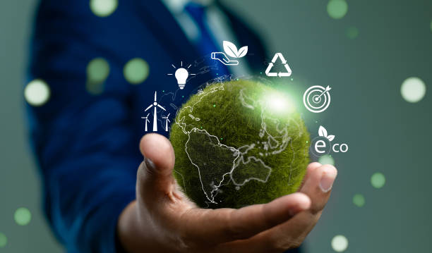 istock World environment day, Responsibility for a green planet, Sustainable growth, and global conservation.Businessman holding green world, Sustainable development goals and corporate social responsibility 2193880753