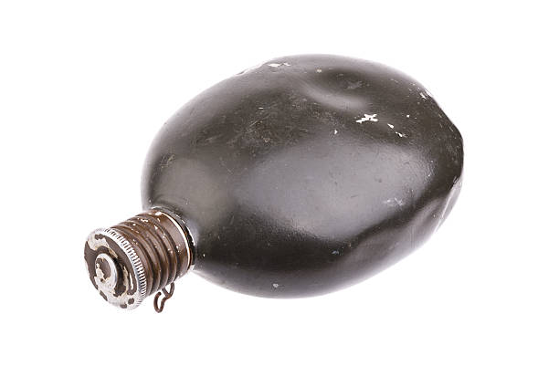Military flask for water with a bowl for food on a white background