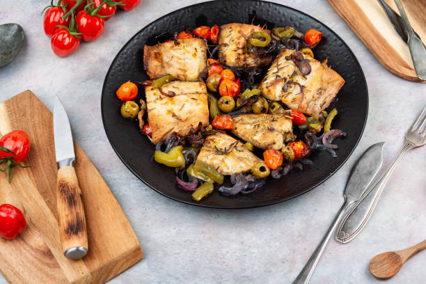 istock Fish fillet and baked vegetables. 2193883278