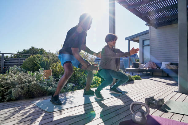 istock Friends exercising on patio 2193886070