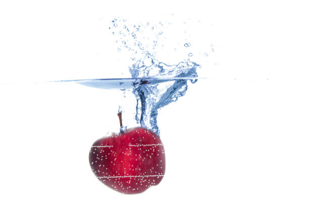 slice one citrus fruit with sparkling water in a glass with white background