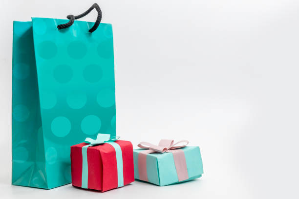 istock Colorful gift bags and wrapped presents on a white background 2193888855