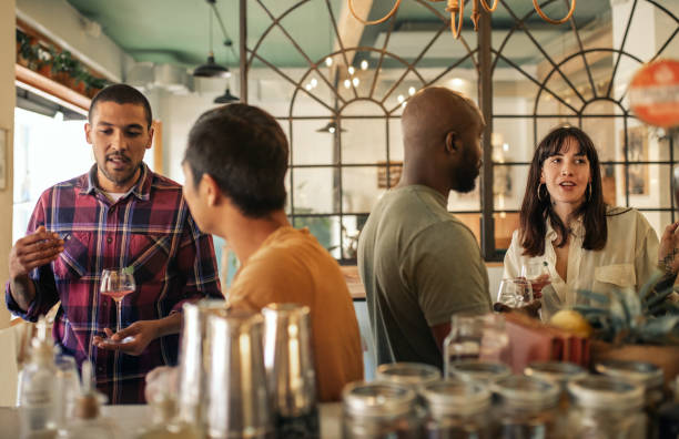 istock Diverse young friends having drinks together in a bar 2193889703