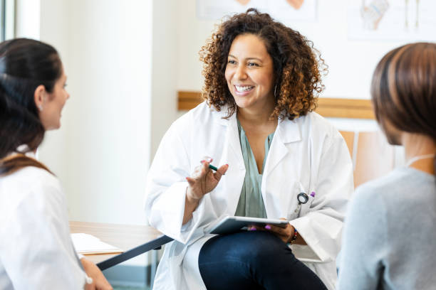 istock Doctor and Patients in Group Therapy Session 2193889802