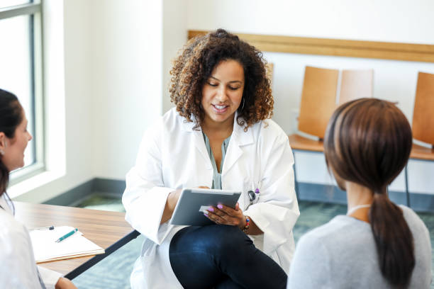 istock Doctor using digital tablet during patient consultation 2193889803