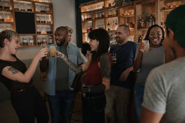 istock Diverse young friends having fun together in a bar 2193889821