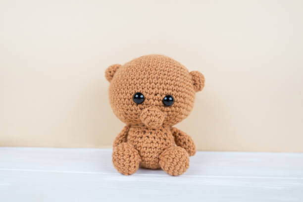 istock Brown bear. Crochet. Good toys Colored yarn.  Handwork. 2193890084