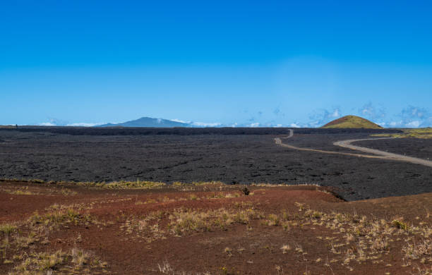 istock Volcanic Terrain and Highway near Mauna Kea 2193890191