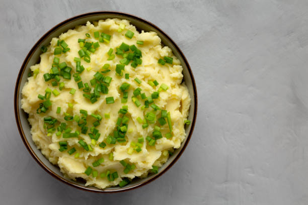 istock Homemade Mashed Potatoes with Chives in a Bowl, top view. Flat lay, overhead, from above. Space for text. 2193890522