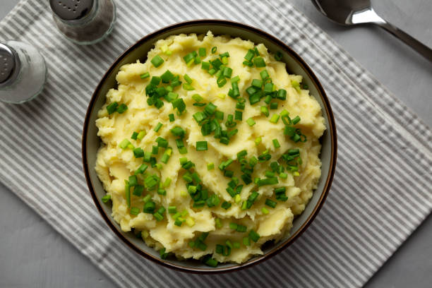 istock Homemade Mashed Potatoes with Chives in a Bowl, top view. Flat lay, overhead, from above. 2193890558