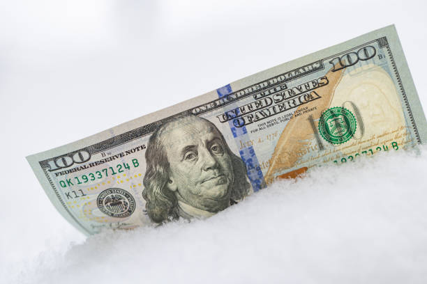 istock US 100 dollar banknote on the snow 2193890577