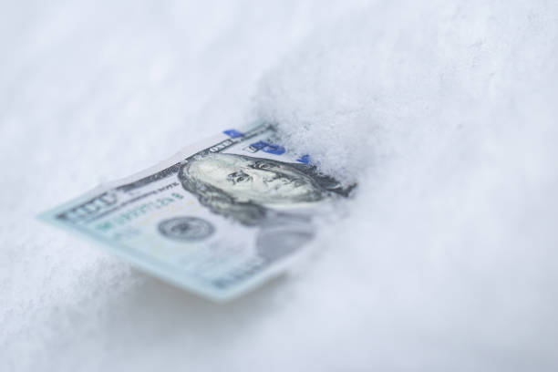 istock US 100 dollar banknote on the snow 2193890586