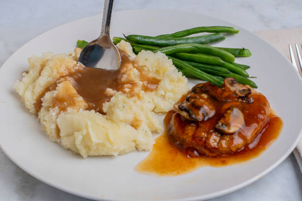 istock salisbury steak  with  green beans and mash potatoes 2193890595