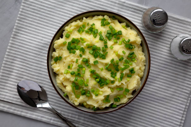 istock Homemade Mashed Potatoes with Chives in a Bowl, top view. Flat lay, overhead, from above. 2193891236