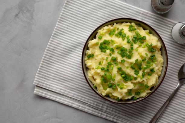 istock Homemade Mashed Potatoes with Chives in a Bowl, top view. Copy space. 2193891311