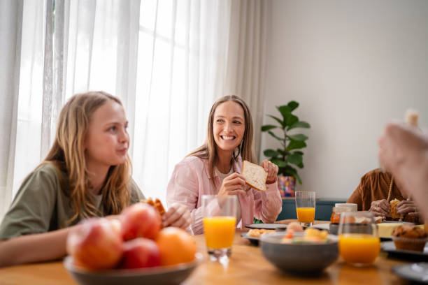 istock Family enjoying breakfast together at dining table 2193891811