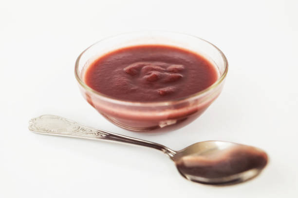 istock plum jam in a glass plate on a white background, close-up 2193892939