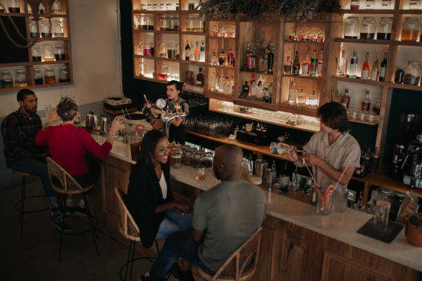 istock People talking and enjoying a night out at the pub 2193893095