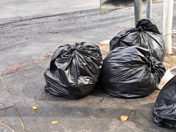 istock Black plastic garbage bag on street. Waste management. Housekeeping concept 2193893116